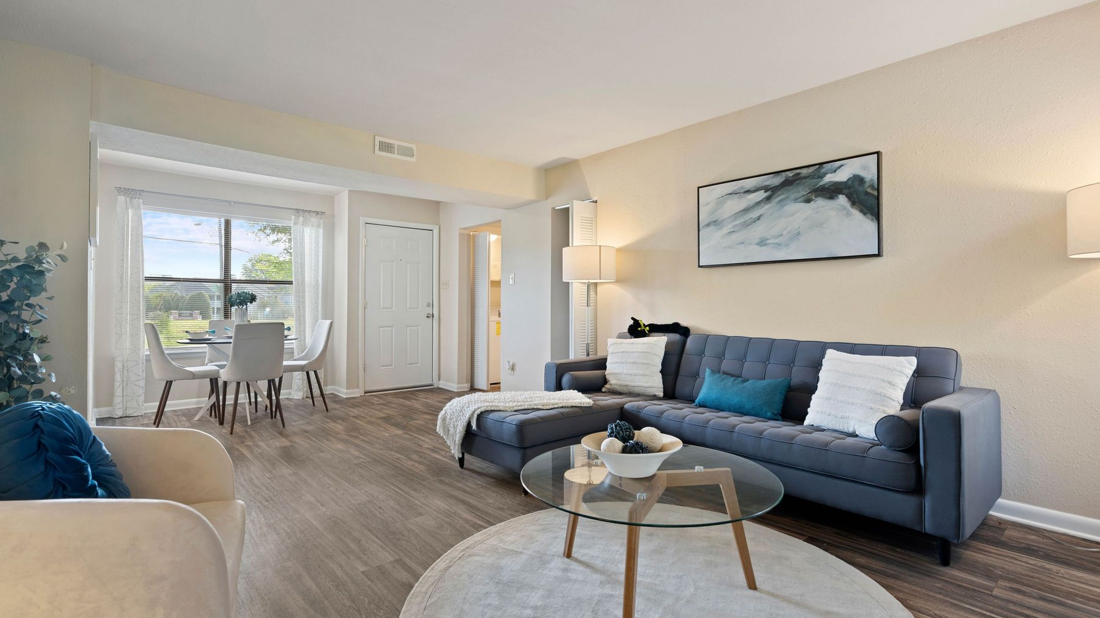 Hawthorne at Oak Ridge apartment interior showing living and dining area with large windows